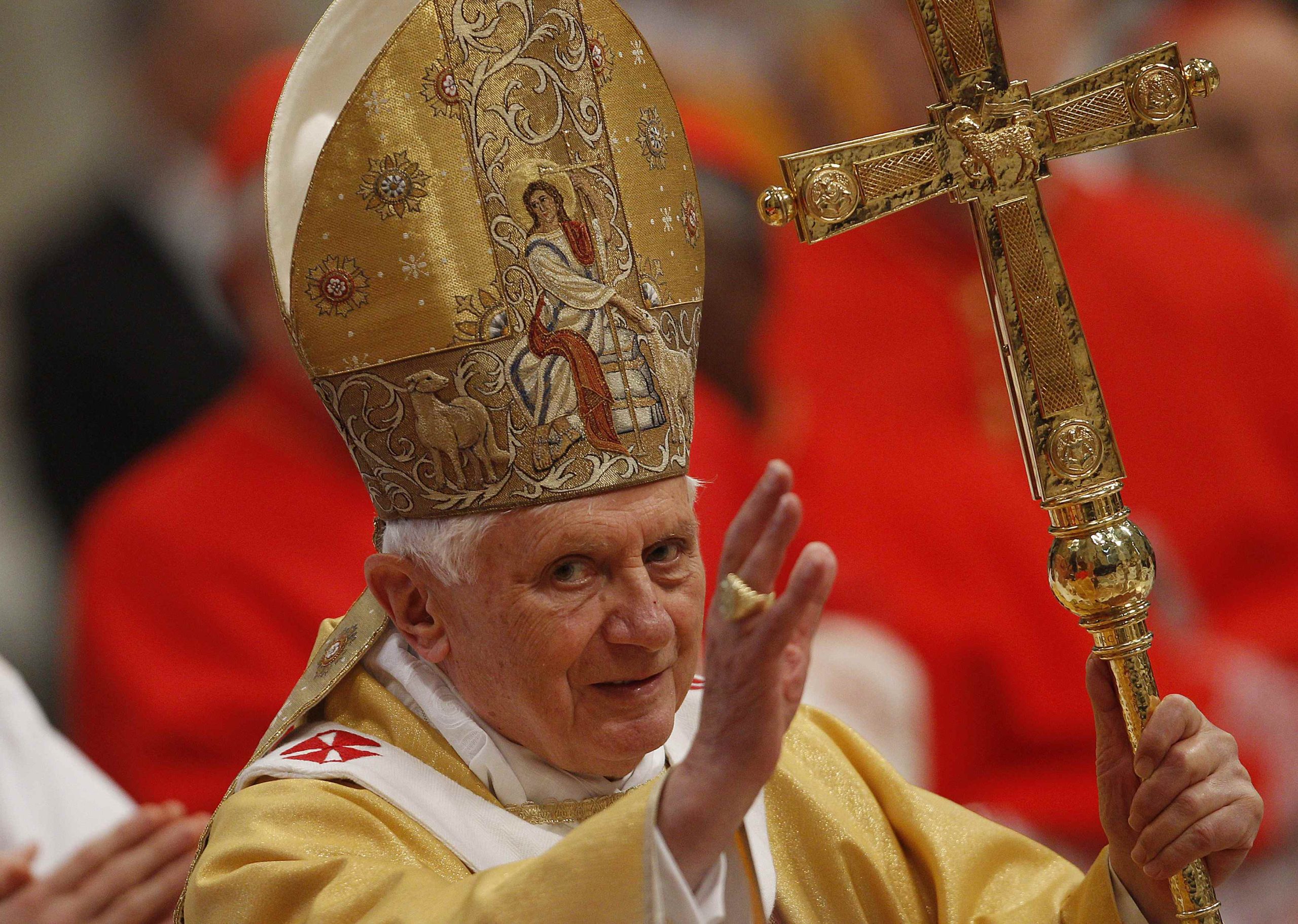 Pope Benedict XVI waves as he arrives to celebrate a mass in Saint Peter's Basilica at the Vatican